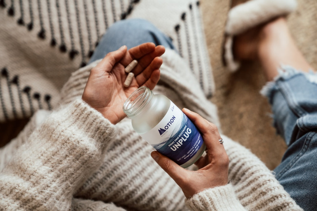 Woman with supplements representing perimenopause and hormone balance support